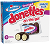 Box of Snack Packs of Frosted Hostess Donettes.